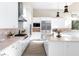 Bright, modern kitchen with white cabinets, stainless steel appliances, and an island at 11015 Sanctuary Cove Ct, Las Vegas, NV 89135