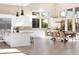 Open floorplan with gourmet kitchen, dining area, and abundant natural light at 11015 Sanctuary Cove Ct, Las Vegas, NV 89135