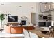 Stylish living area with fireplace, modern lighting, and comfortable seating at 11015 Sanctuary Cove Ct, Las Vegas, NV 89135
