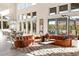 Open-concept living room with large windows, modern décor, and a spacious seating area at 11015 Sanctuary Cove Ct, Las Vegas, NV 89135