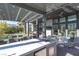 Outdoor kitchen and dining area under a pergola at 11015 Sanctuary Cove Ct, Las Vegas, NV 89135
