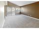 Sunlit living room with sliding glass doors at 1324 Royal Creek Ct, North Las Vegas, NV 89031