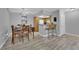 Dining area with wood table and chairs near kitchen at 1455 E Katie Ave # D12, Las Vegas, NV 89119