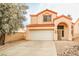 Two-story house with a white garage door and terracotta roof tiles at 1604 Tamborine Ct, Las Vegas, NV 89128