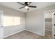 Bedroom with ceiling fan, window, and walk-in closet at 1743 Eddingham Ct, Las Vegas, NV 89156