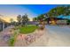 Landscaped grounds with a circular driveway leading to the house at 1920 Silver Ave, Las Vegas, NV 89102