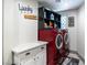 Convenient laundry room with red washer and dryer, and ample storage at 1920 Silver Ave, Las Vegas, NV 89102