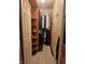 Walk-in closet with shelving and hanging clothes at 2167 N Walnut Rd, Las Vegas, NV 89115