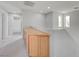 Upstairs hallway with built-in wooden cabinets and carpet at 2586 Begonia Valley Ave, Henderson, NV 89074