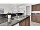 Modern kitchen with granite countertops and stainless steel sink at 3727 Grey Hills Dr, North Las Vegas, NV 89032