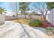 Landscaped backyard with grassy area and a large patio at 4125 Montemesa Cir, Las Vegas, NV 89108