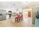 Modern kitchen with white cabinets, granite countertops, and island with seating at 4125 Montemesa Cir, Las Vegas, NV 89108