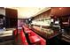 Upscale bar with red seating and marble top at 4381 W Flamingo Rd # 3216, Las Vegas, NV 89103