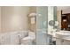Bathroom with toilet and double vanity with marble tile at 4381 W Flamingo Rd # 3216, Las Vegas, NV 89103