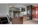 Sleek kitchen with stainless steel appliances and breakfast bar at 4381 W Flamingo Rd # 3216, Las Vegas, NV 89103