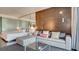 Open living room with sectional sofa and large glass coffee table at 4381 W Flamingo Rd # 3216, Las Vegas, NV 89103