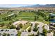 Aerial view of community with golf course, clubhouse, and lake at 4430 Deliza Ln, Pahrump, NV 89061