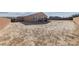 Large, unlandscaped backyard with block wall, providing ample space at 4430 Deliza Ln, Pahrump, NV 89061
