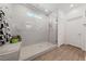 Large walk-in shower with glass enclosure and bench at 4430 Deliza Ln, Pahrump, NV 89061