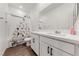 Charming bathroom with white vanity and cat-themed shower curtain at 4430 Deliza Ln, Pahrump, NV 89061