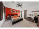 Spacious bedroom with red accent wall and barn door at 4430 Deliza Ln, Pahrump, NV 89061