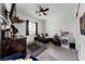 Bright bedroom with a bed, desk, and ample natural light at 4430 Deliza Ln, Pahrump, NV 89061