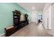 Bright entryway with built-in bench and mirror, and a teal accent wall at 4430 Deliza Ln, Pahrump, NV 89061