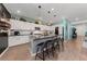 Modern kitchen with white cabinets, stainless steel appliances, and an island at 4430 Deliza Ln, Pahrump, NV 89061