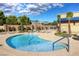 Relaxing community pool with lounge chairs and mountain views at 4430 Deliza Ln, Pahrump, NV 89061