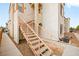 Exterior view of a two-story building with stairs and walkway at 4655 Gold Dust Ave # 210, Las Vegas, NV 89120
