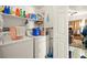 Laundry room with washer, dryer, and storage shelves at 4655 Gold Dust Ave # 210, Las Vegas, NV 89120
