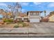 Two-story house with a landscaped yard and attached garage at 5017 Wright View Dr, Las Vegas, NV 89120