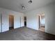 Bright bedroom with ceiling fan and carpet flooring at 519 Crestway Rd, Henderson, NV 89015