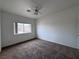 Bright bedroom with carpeted floor, ceiling fan, and window at 519 Crestway Rd, Henderson, NV 89015