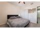 Bedroom with a queen bed, closet, and mirror at 5655 E Sahara Ave # 2064, Las Vegas, NV 89142