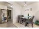 Dining area with glass table and six gray chairs at 5655 E Sahara Ave # 2064, Las Vegas, NV 89142