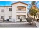 Two-story condo building with walkway and landscaping at 5655 E Sahara Ave # 2064, Las Vegas, NV 89142