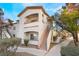 Two-story condo building with walkway and landscaping at 5655 E Sahara Ave # 2064, Las Vegas, NV 89142