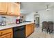 L-shaped kitchen with light wood cabinets and appliances at 5655 E Sahara Ave # 2064, Las Vegas, NV 89142