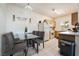 Eat-in kitchen with light wood cabinets and glass table at 5655 E Sahara Ave # 2064, Las Vegas, NV 89142