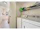 Laundry room with washer, dryer and shelving at 5655 E Sahara Ave # 2064, Las Vegas, NV 89142