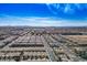 Expansive aerial view of a residential community with mountain views and blue skies at 6935 Magenta Moon St, North Las Vegas, NV 89086