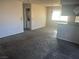 Open living and dining space with carpeted floors at 7200 Pirates Cove Rd # 2025, Las Vegas, NV 89145