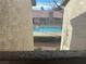 Community pool viewed through building openings at 7200 Pirates Cove Rd # 2025, Las Vegas, NV 89145