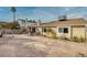 Spacious backyard featuring a covered patio and a large gravel area, ideal for outdoor living and entertainment at 750 Willow Ave, Henderson, NV 89002