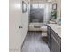 Modern bathroom with a tiled shower and a sleek gray vanity at 750 Willow Ave, Henderson, NV 89002