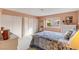 Charming bedroom with natural light, a cozy bed, and closet space at 750 Willow Ave, Henderson, NV 89002