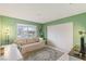 Cozy bedroom showcasing a comfortable sofa, study area, and closet at 750 Willow Ave, Henderson, NV 89002