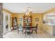 Inviting dining area with wood floors, a round table, and access to the kitchen at 750 Willow Ave, Henderson, NV 89002