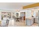 Bright dining area featuring wood floors, sliding glass doors, and a charming china cabinet at 750 Willow Ave, Henderson, NV 89002